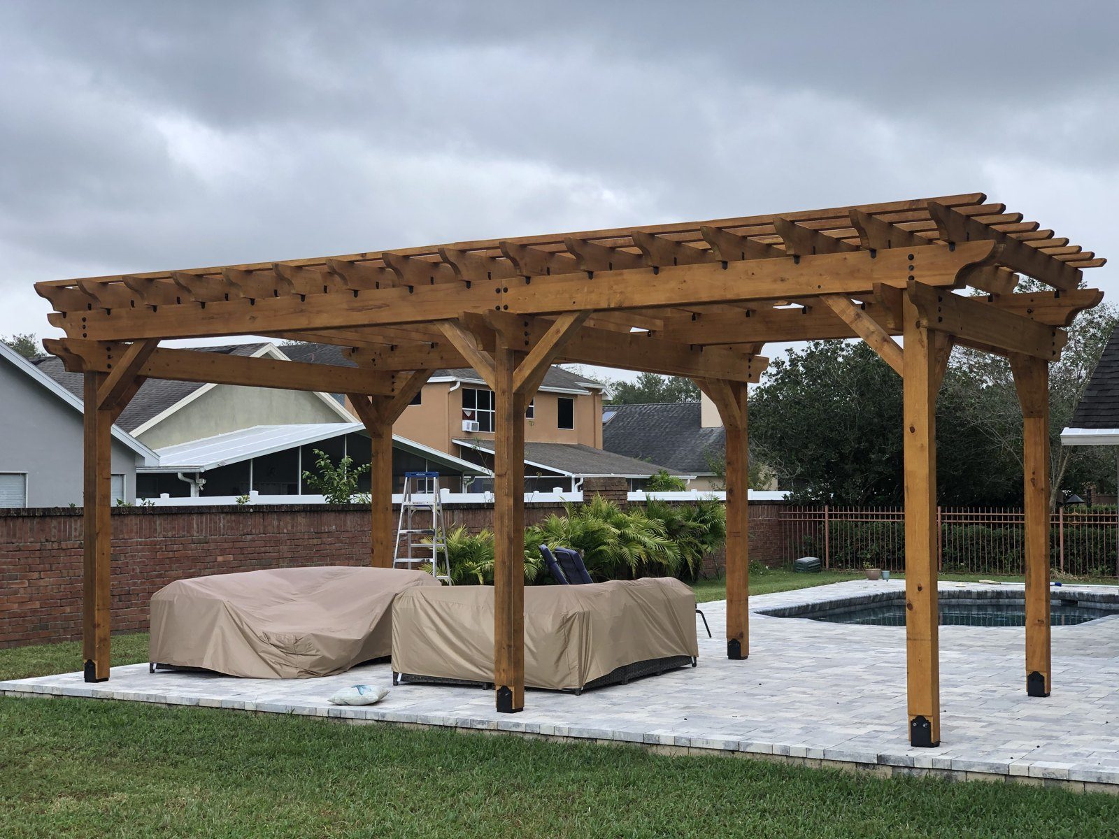 Wood Pergola · Poolside Paver Patio