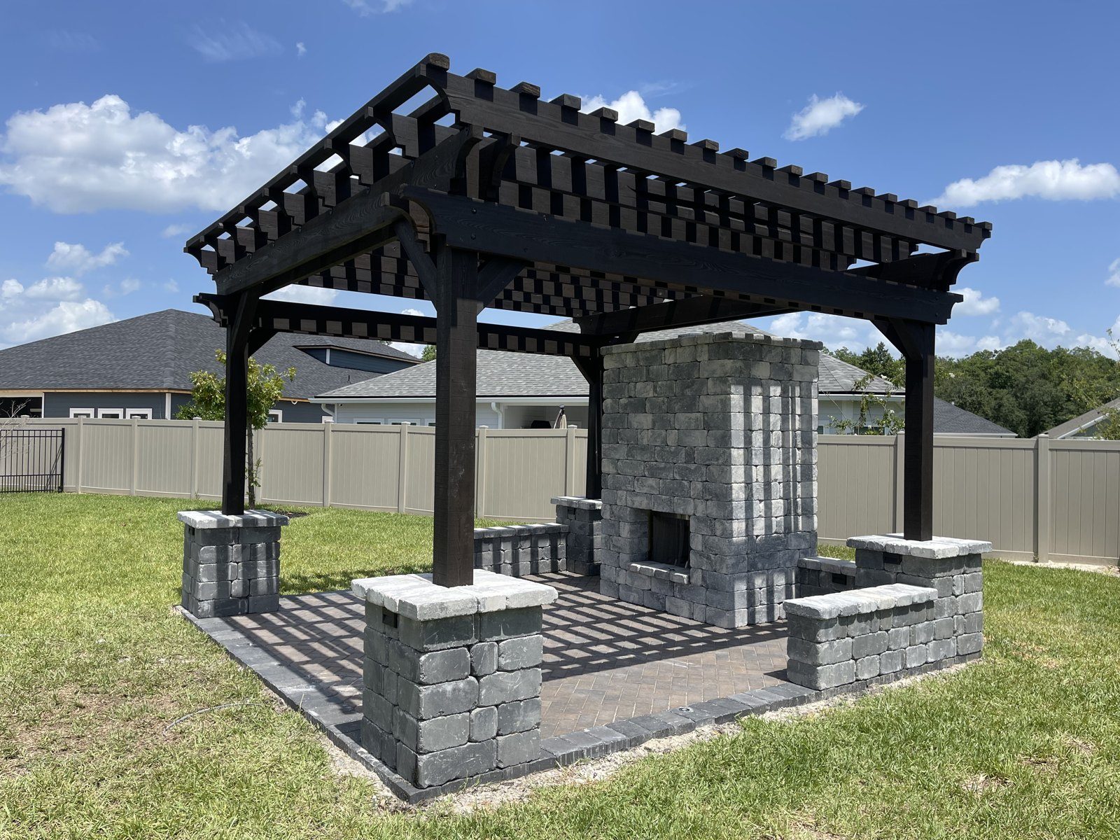 Pergola with Paver Fireplace & Seating Walls